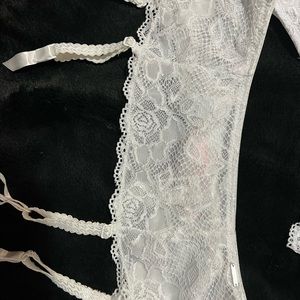 Brand new lingerie set including bra , thong and Garter belt.
